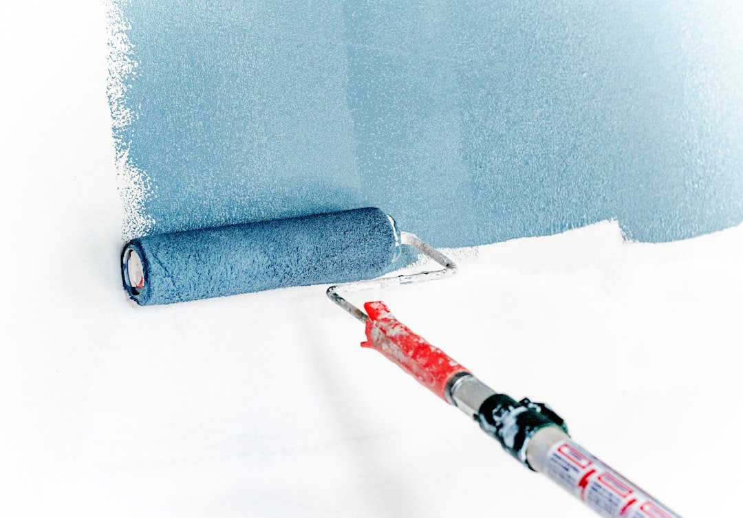 Paint roller applying color to an interior wall